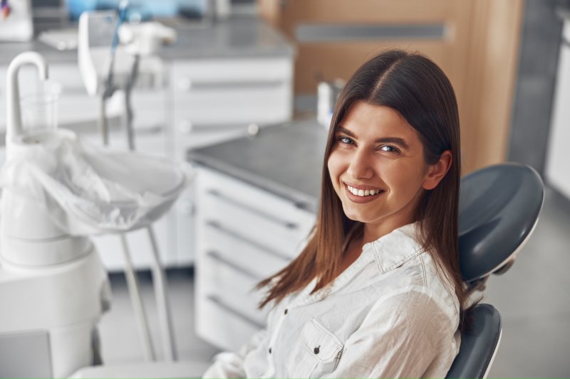 A smiling woman preparing to receive cosmetic dentistry